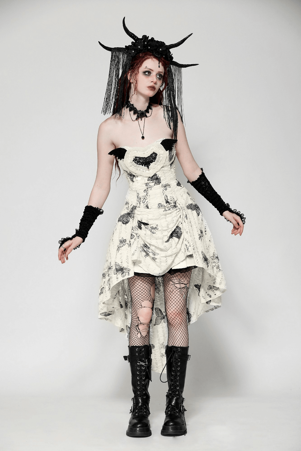Model in gothic butterfly print lace-up off-shoulder dress with dramatic details and edgy accessories.