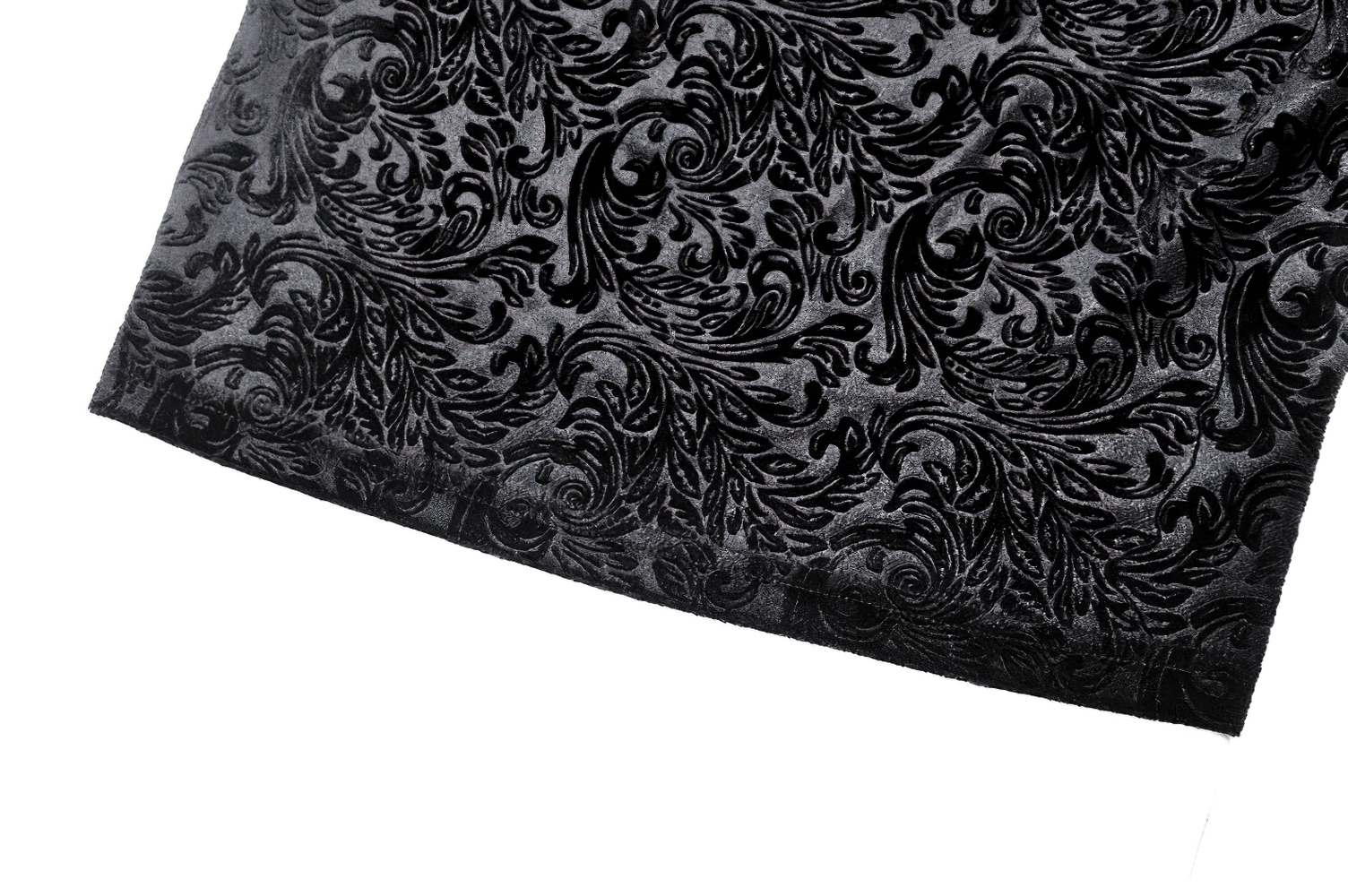 Close-up of intricate black velvet embossed pattern, showcasing gothic elegance and dark romantic style.