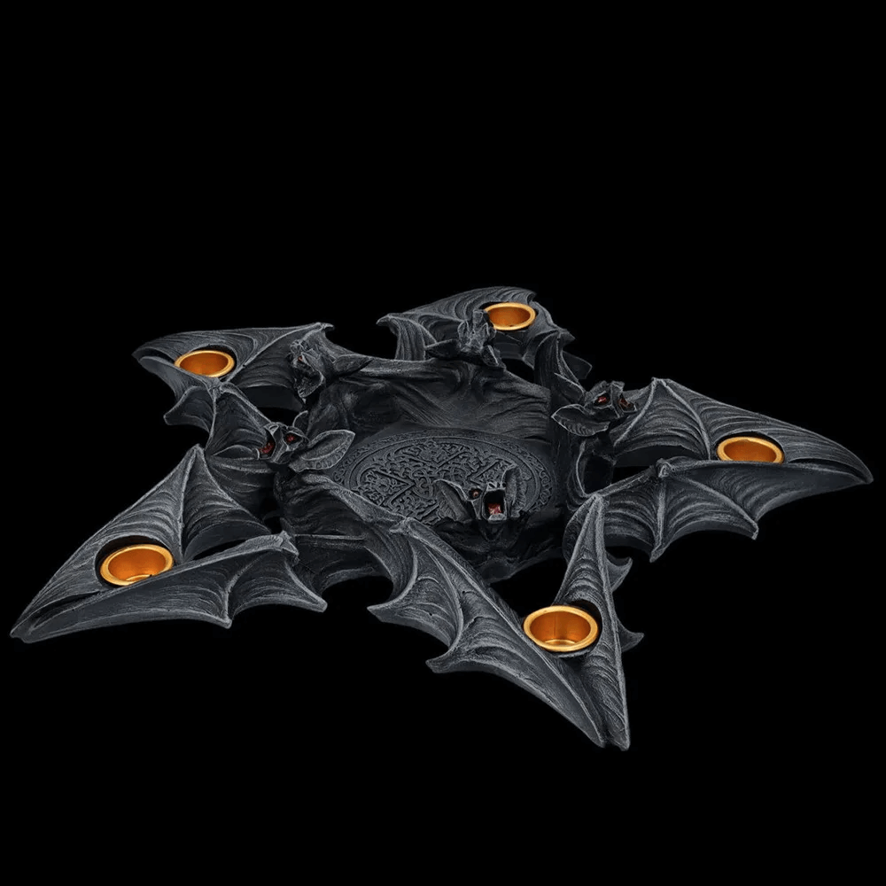 Gothic candle holder with bat details, perfect for Halloween decor and spooky ambiance.