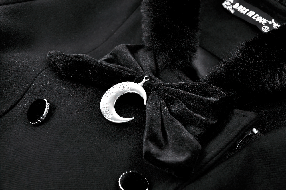 Close-up of a gothic short coat featuring a cat ear hood, plush detailing, and a crescent moon charm.