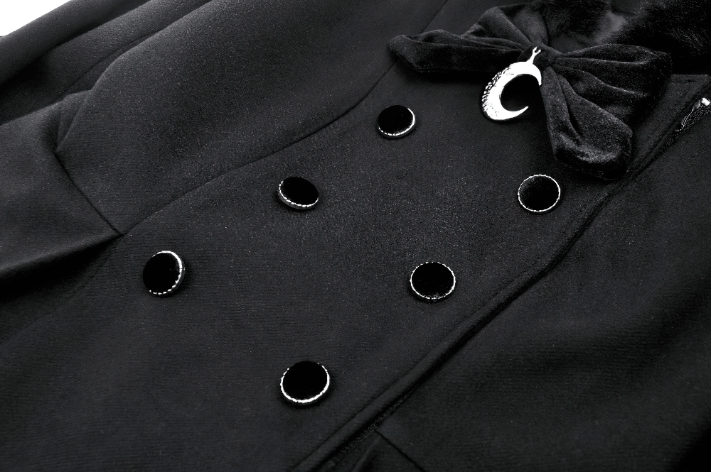 Close-up of black gothic coat buttons and bow detail showcasing luxurious style features.