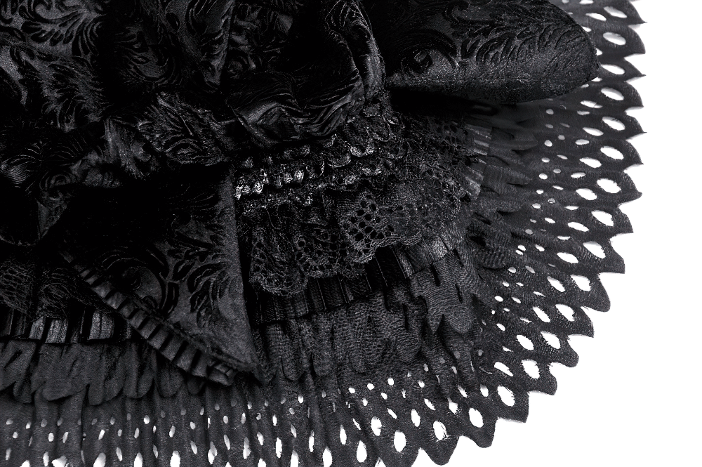 Intricate black lace and velvet detailing of a Gothic cat ear lace bonnet, showcasing vintage elegance and whimsical flair.