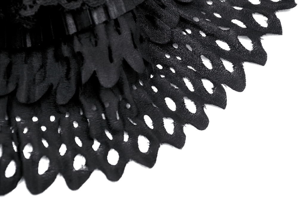 Close-up of intricate black lace trim from a gothic cat ear bonnet, showcasing vintage detailing and elegant design.