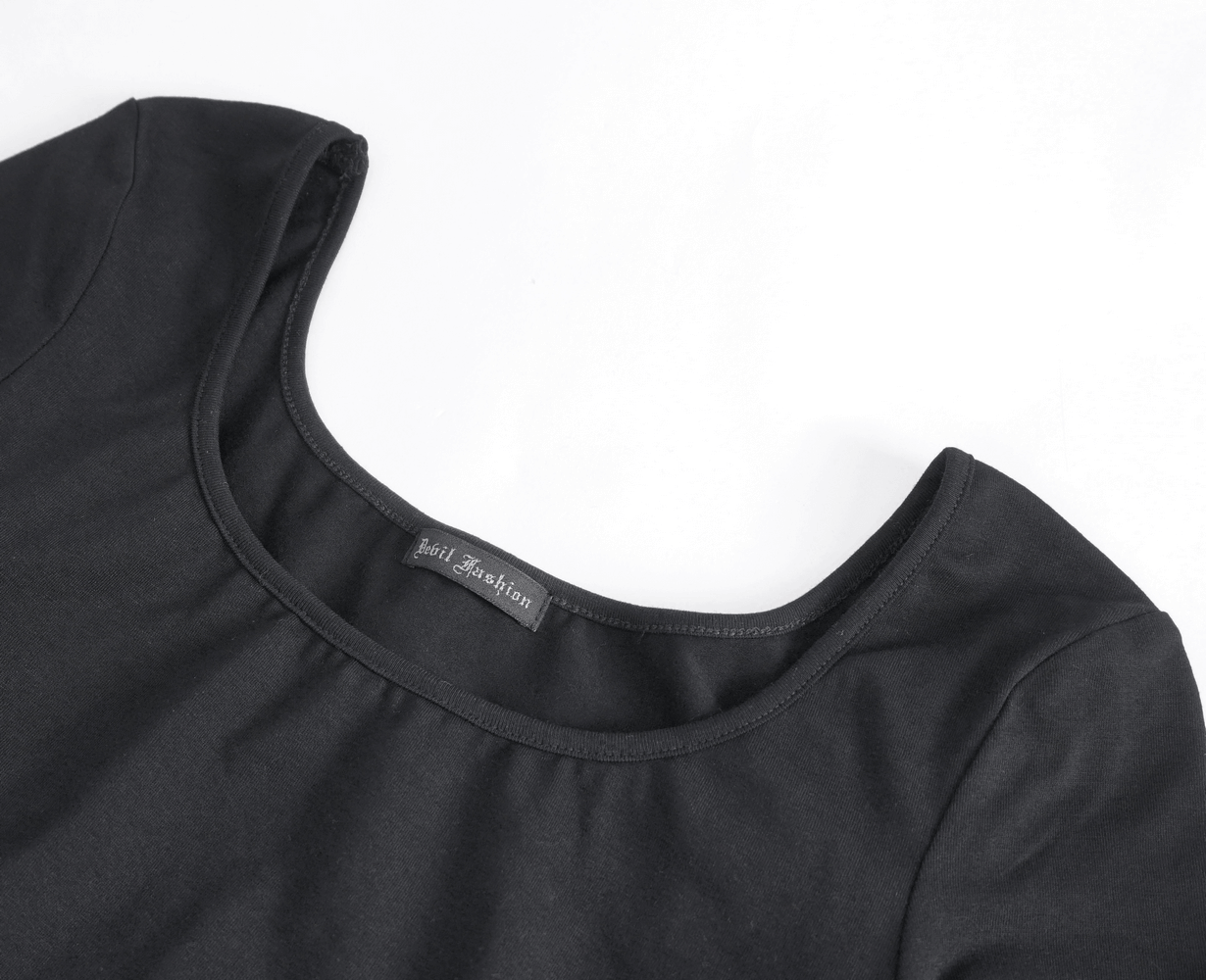 Close-up of gothic black crop top showing scoop neckline and fabric details, perfect for edgy fashion.