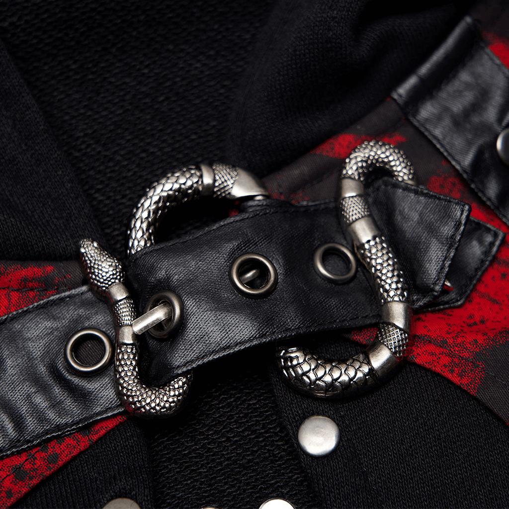 Close-up of gothic chain detail featuring a snake-shaped buckle on a black and red knit top.