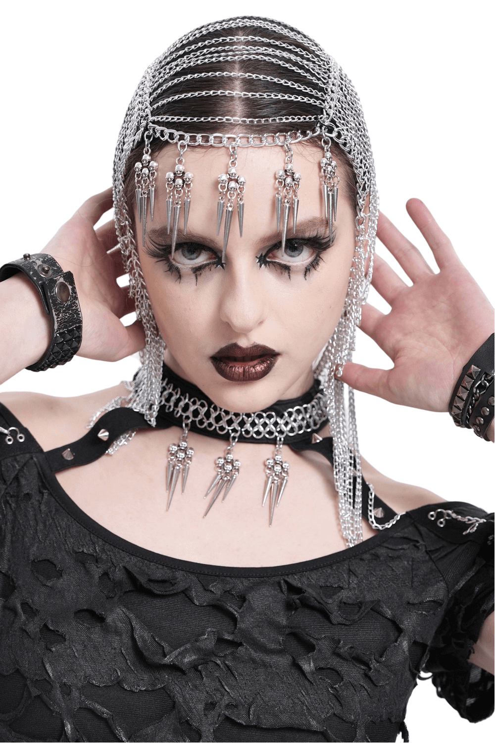 Gothic chain headpiece with spiked skull dangles, enhancing a punk aesthetic for bold fashion statements.