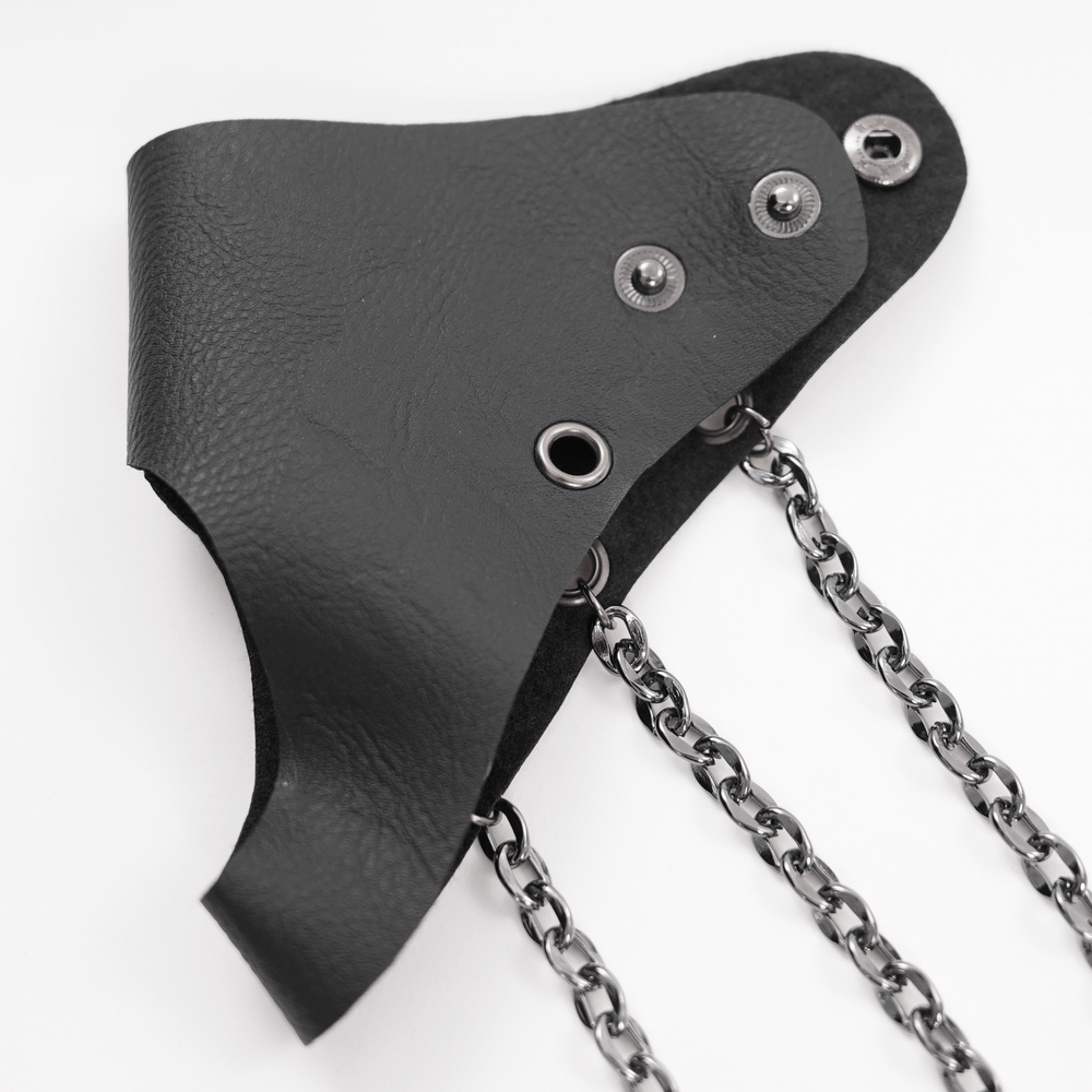 Gothic leather wrist cuff with chains, featuring a punk-inspired design and adjustable snap button closures.