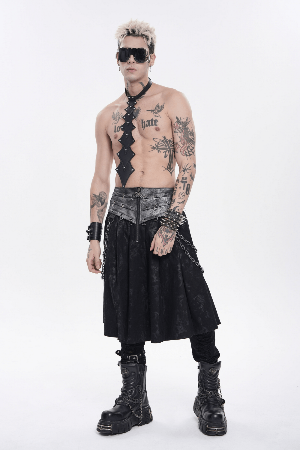 Gothic Chain Midi Skirt with Lace Up Waist Detail showcased by a tattooed model wearing punk accessories and heavy boots.