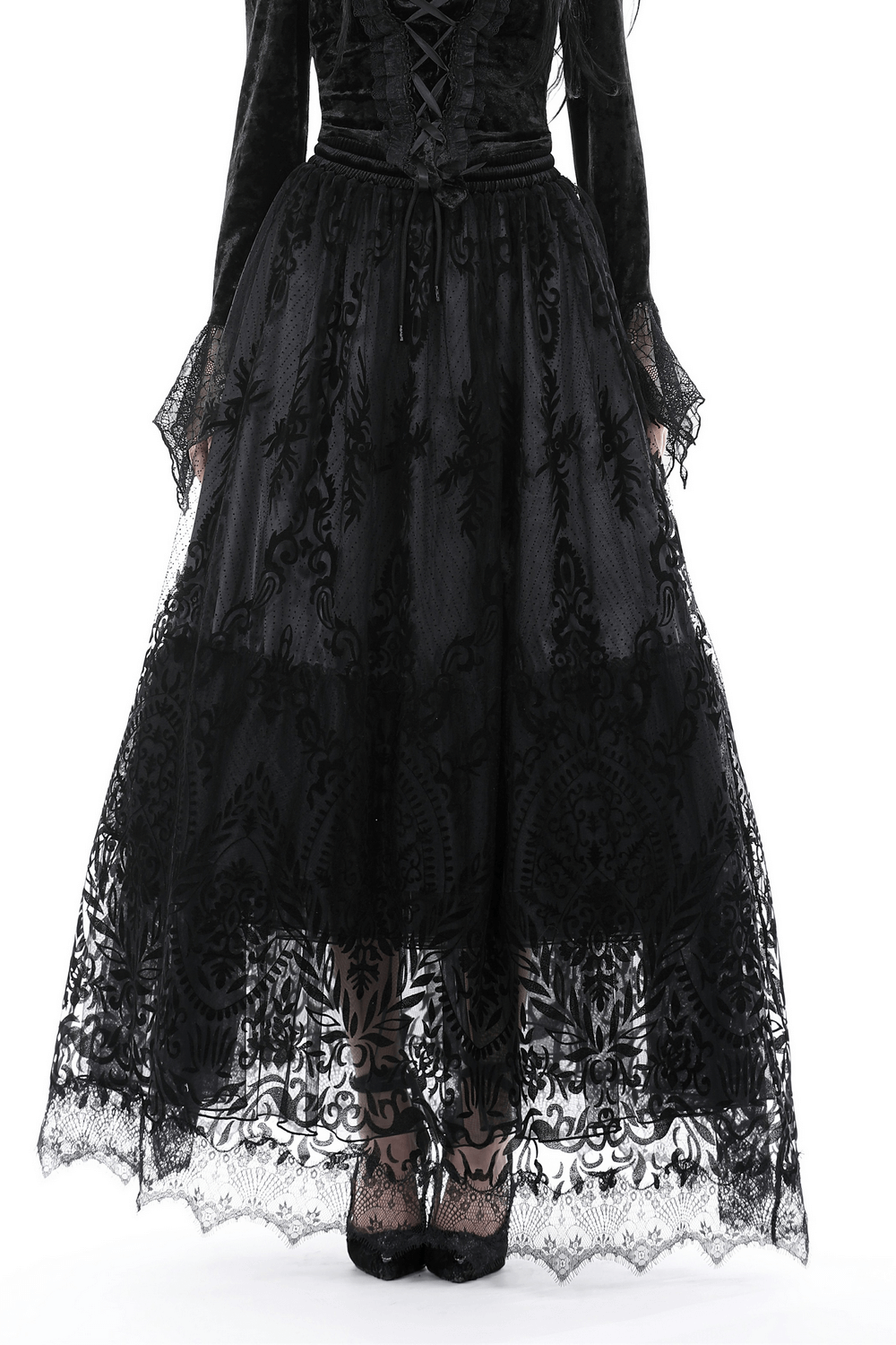 Gothic chic black lace maxi skirt with intricate floral design and sheer overlay.
