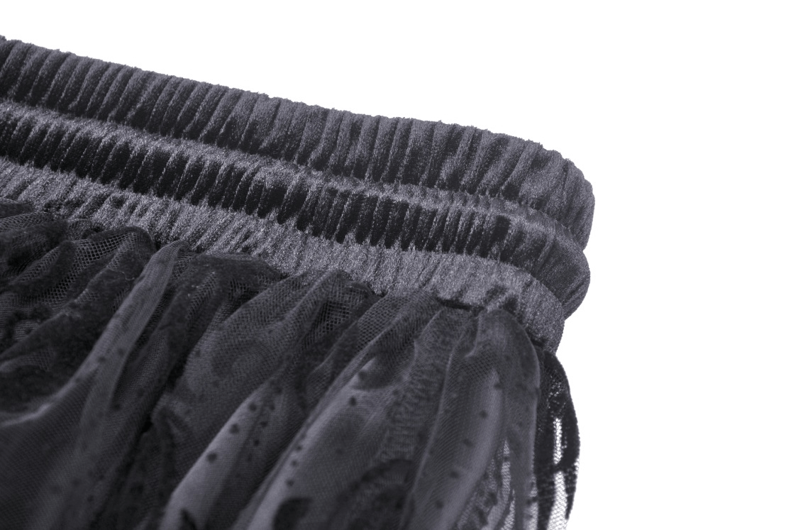 Top view of the black lace maxi skirt's elastic waistband, showcasing its chic and textured design.