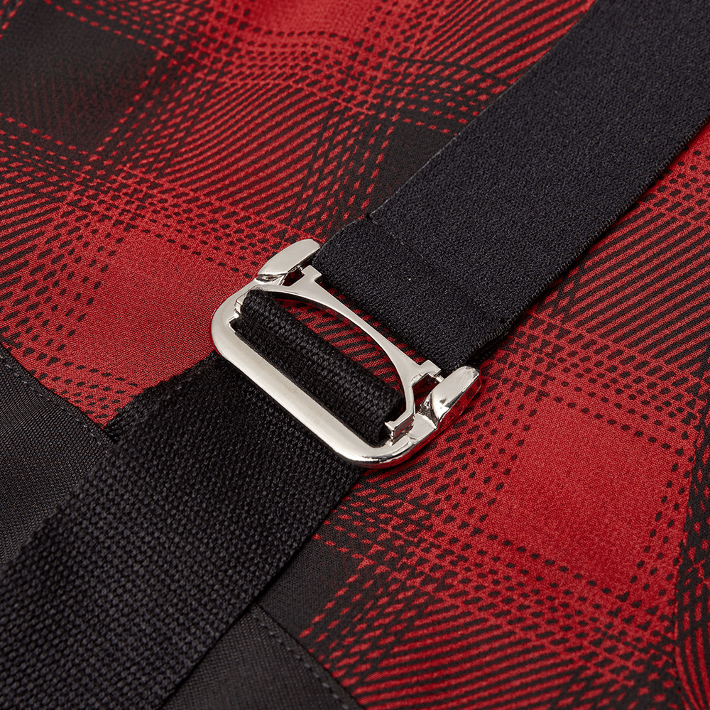 Close-up of metal buckle on black and red plaid mini dress, adding edgy detail to the gothic chic style.