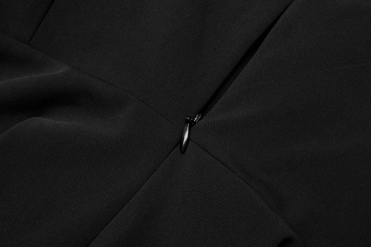 Close-up of the zipper detail on the Gothic Chic Plaid Hooded Mini Dress, showcasing its quality and edgy design.