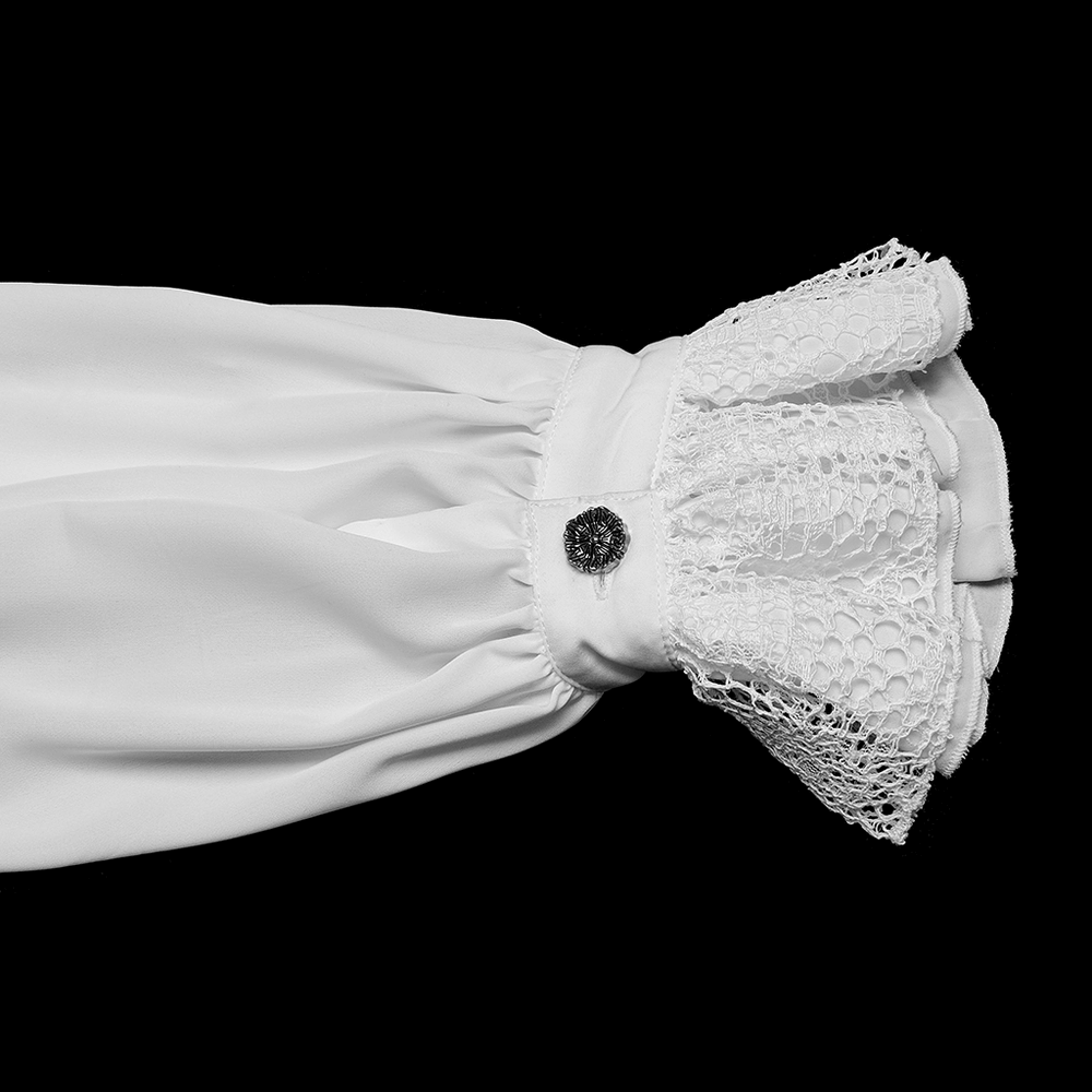 Close-up of a gothic chiffon shirt sleeve with lace trim and decorative button detail.