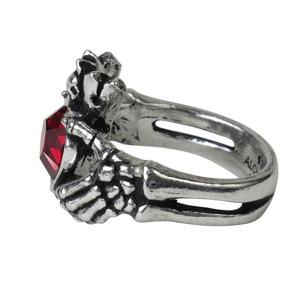 Gothic Claddagh by Night Ring featuring red heart crystal held by skeletal hands, symbolizing love and loyalty.