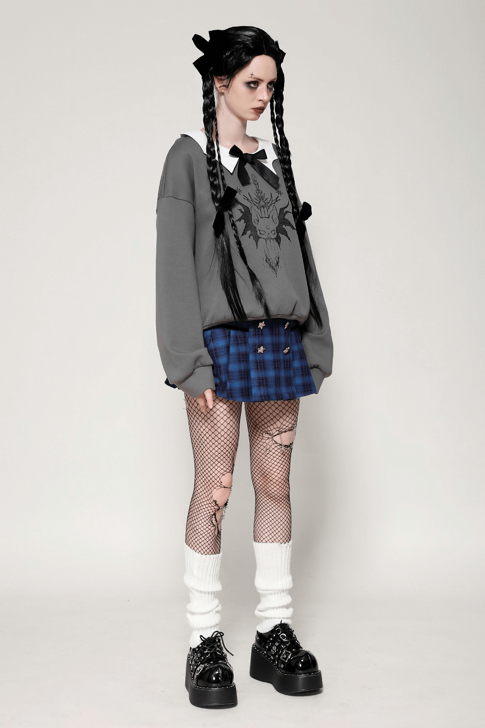 Gothic collar bow sweatshirt with unique cat design, paired with a plaid skirt and fishnet tights for dark aesthetic style.