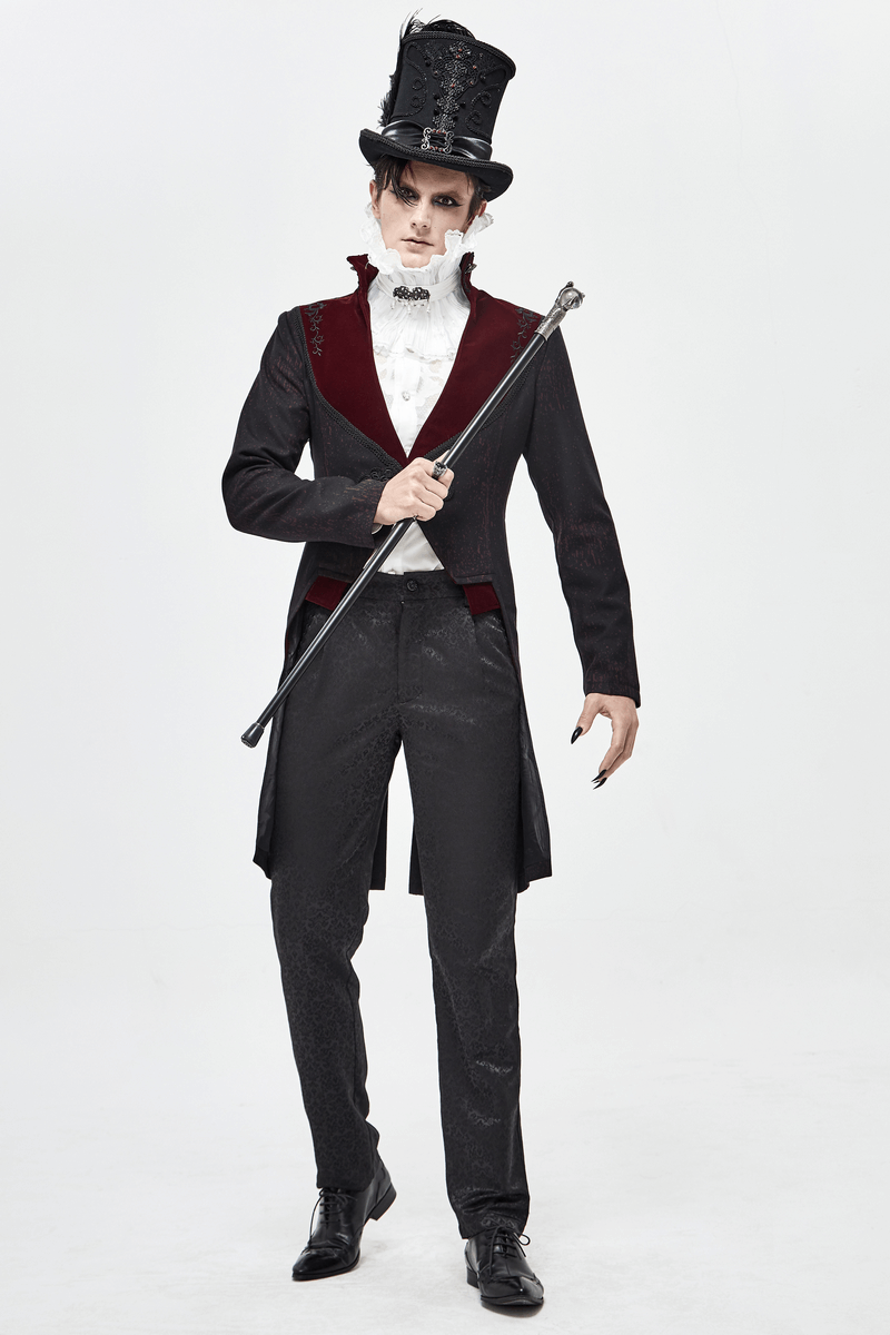 Stylish man in vintage gothic attire with a black coat and top hat, holding a cane for a dramatic look.