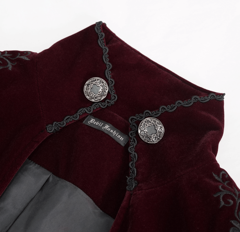 Close-up view of a vintage gothic maroon coat collar featuring ornate buttons and embroidery details.