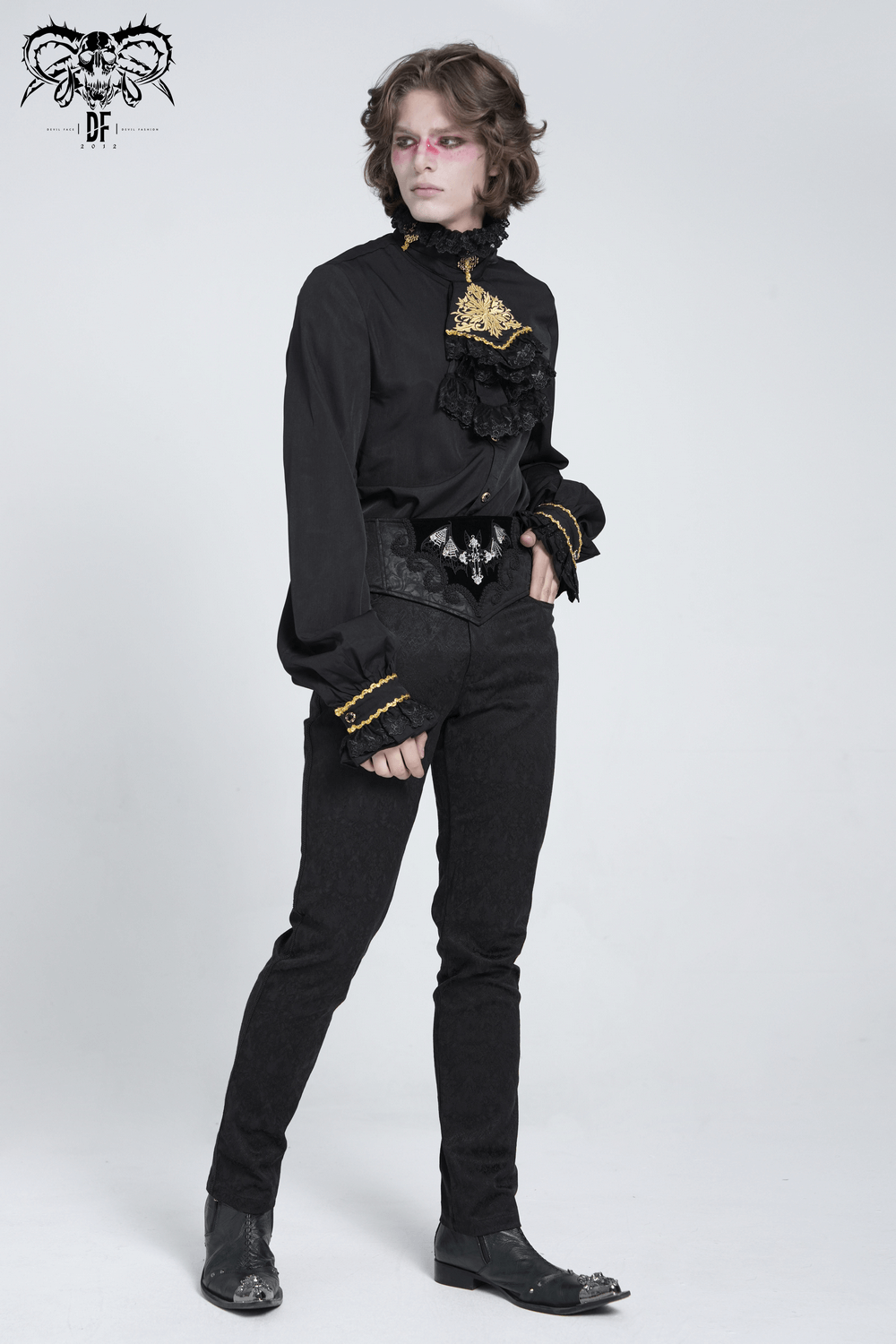 Gothic model in elaborate black attire featuring detailed ruffles, corset belt, and accessories for a dark aesthetic.