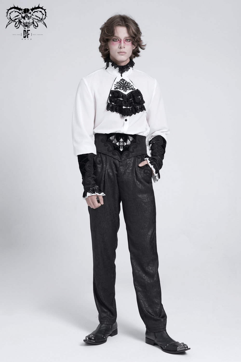 Stylish model wearing a gothic outfit with ruffled details and a corset belt, perfect for alternative fashion looks.