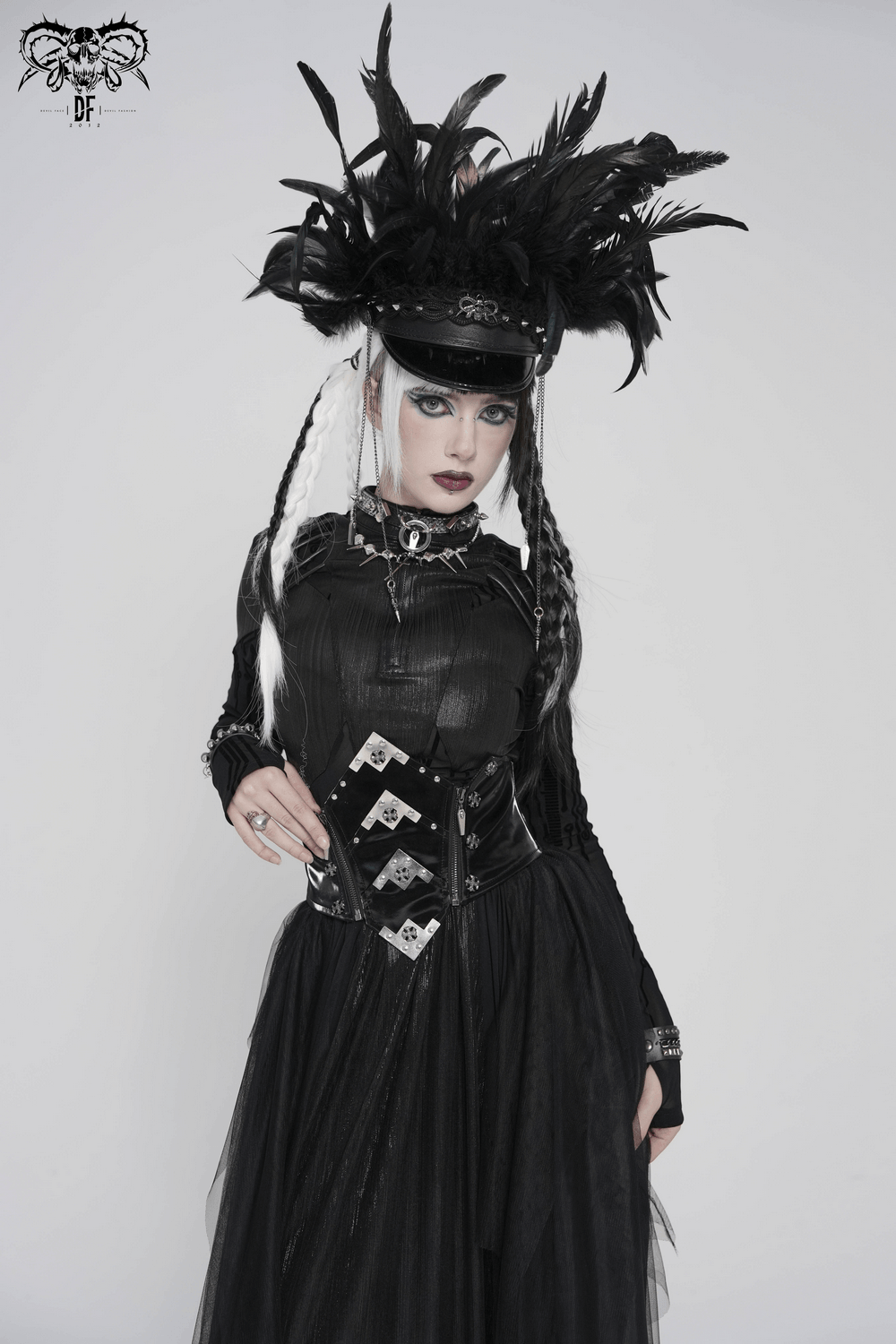 Gothic Corset Belt with Metal Cross Stud Details Trim styled outfit featuring feathers, black attire, and dramatic makeup.