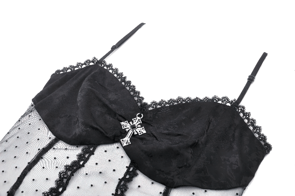 Gothic corset top with polka dot mesh, lace trim, and satin bow, perfect for evening wear or themed parties.
