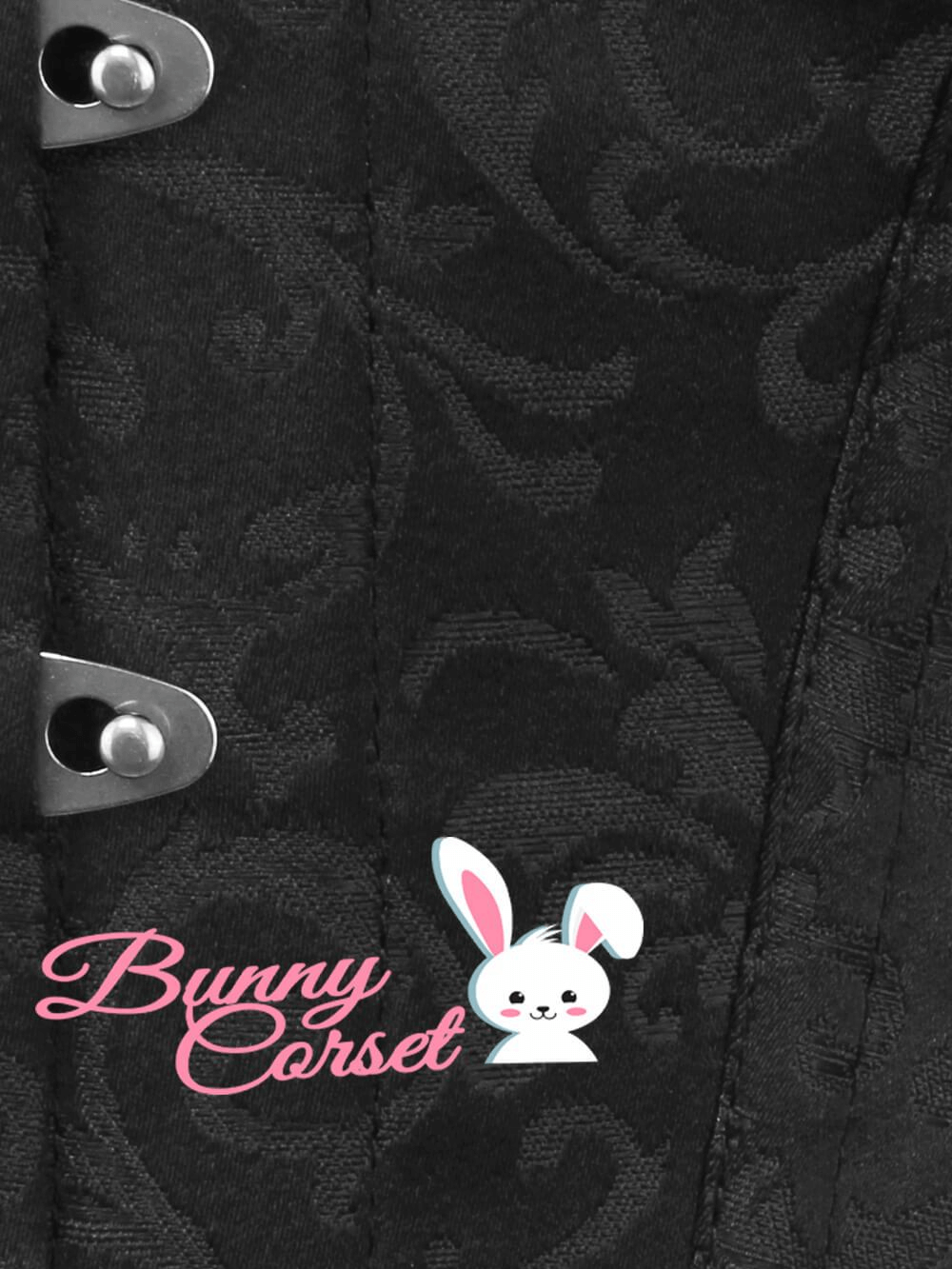 Close-up of black Gothic corset with decorative brocade and metal busk closures, featuring 'Bunny Corset' logo.