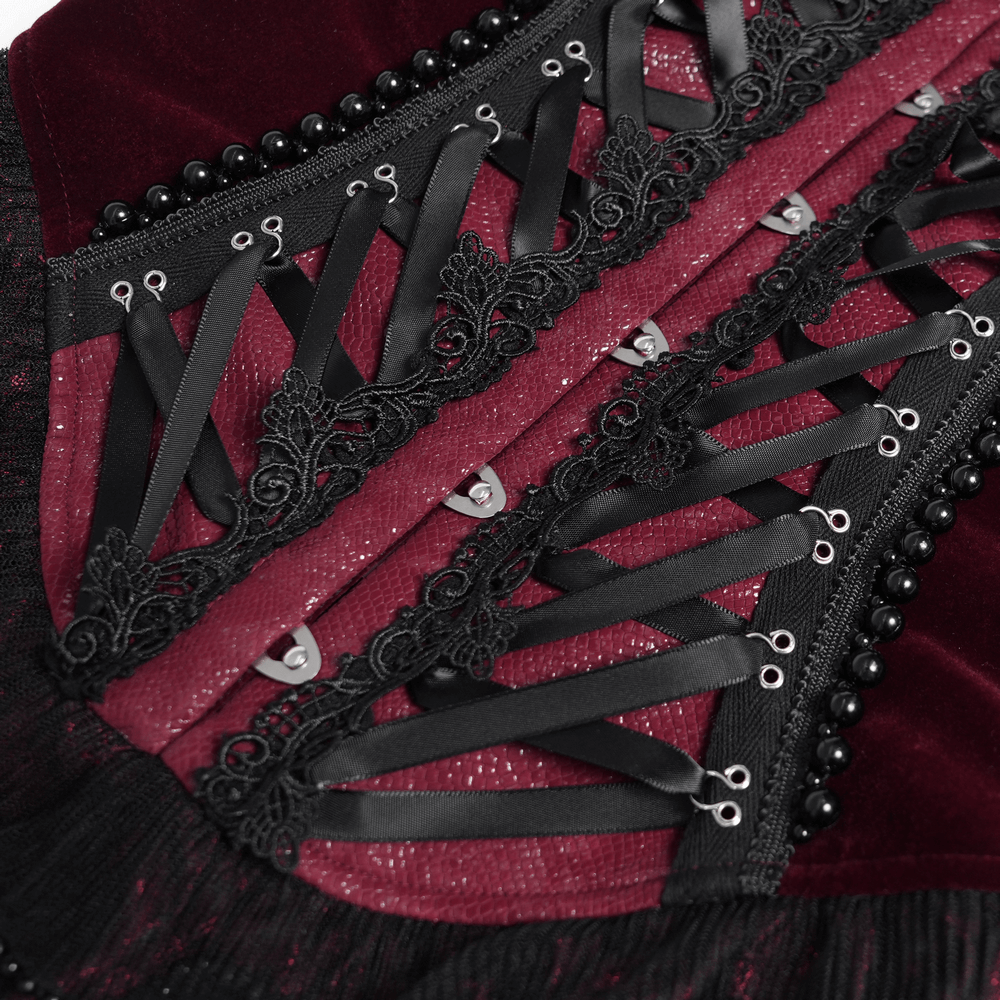 Burgundy gothic corset with lace trim, satin ribbon lacing, and bead chains for dramatic elegance.