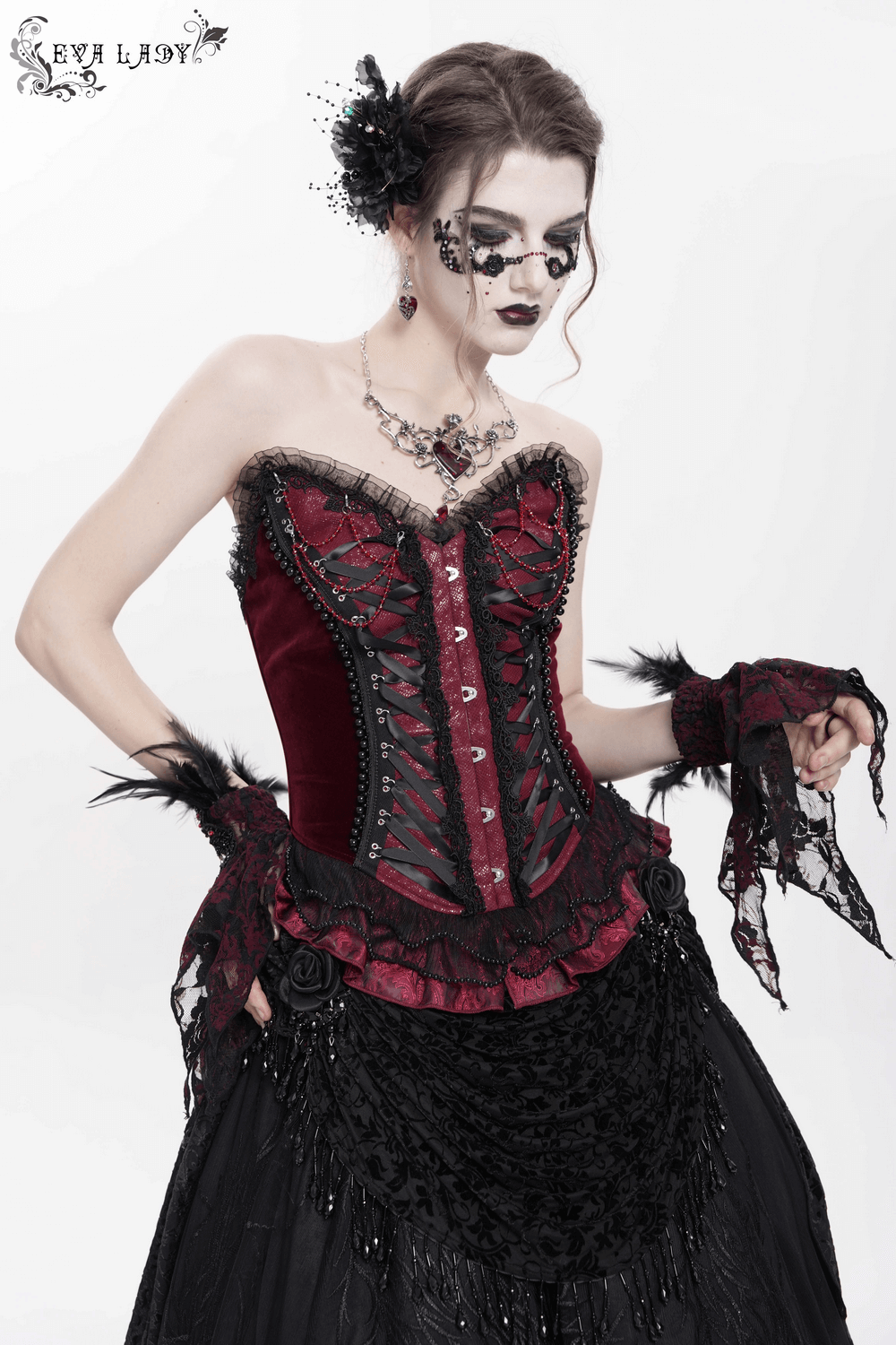Gothic Victorian corset with lace trim, satin lacing, and ruffled hem in burgundy and black.