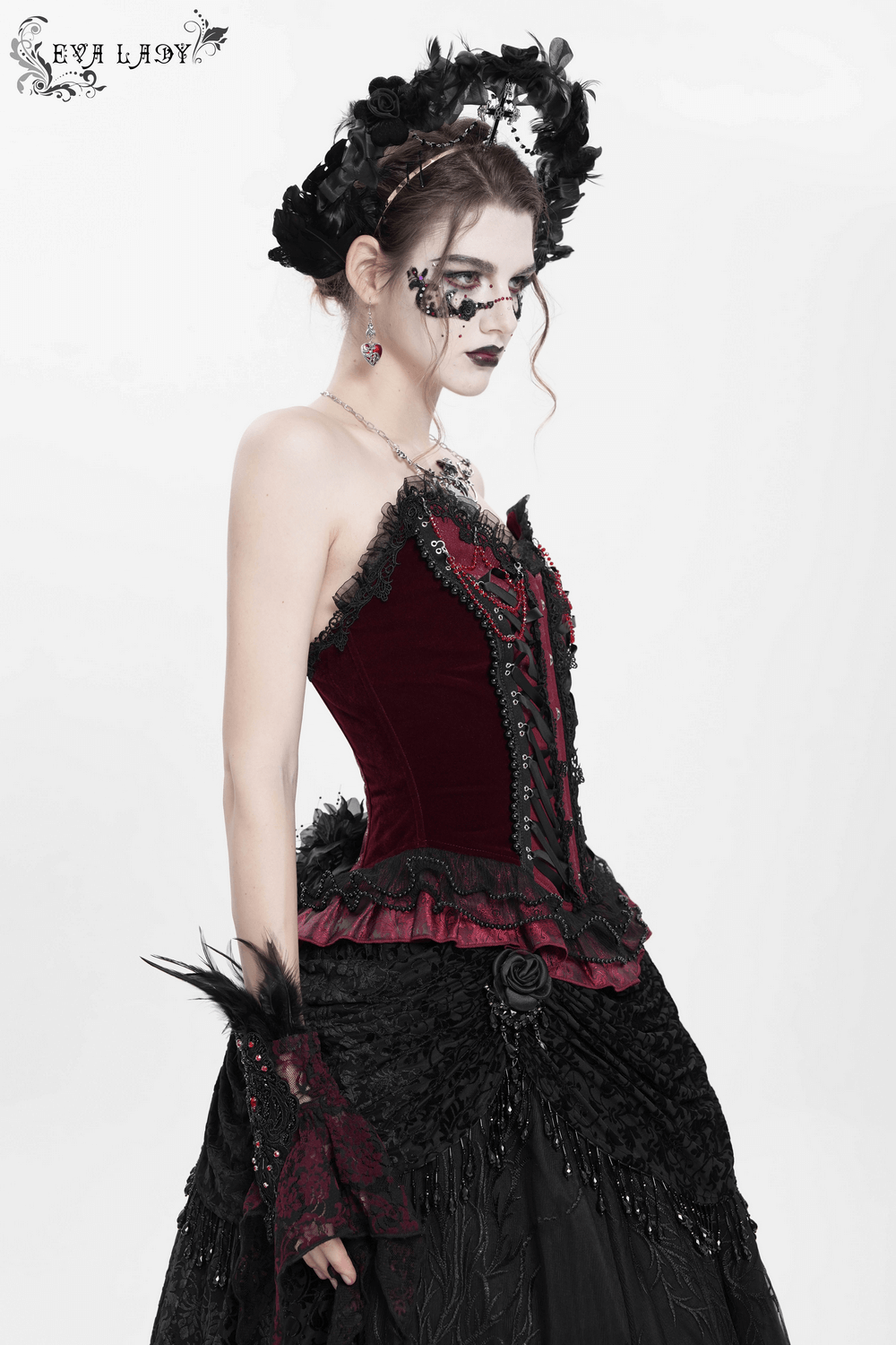 Burgundy gothic corset with lace and satin ribbon, styled with ruffled hem, perfect for Victorian or burlesque fashion.