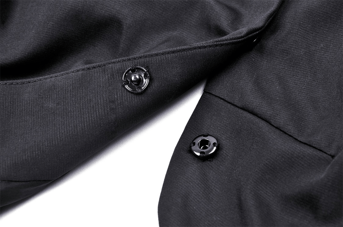 Close-up of black buttons on a gothic cropped lace short jacket, showcasing chic detail and quality craftsmanship.