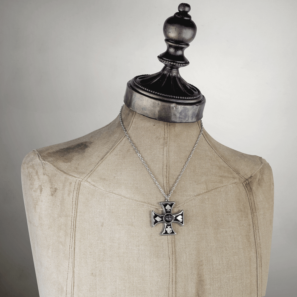 Gothic Cross Pendant with Crown and Card Suit Motifs displayed on a vintage mannequin.