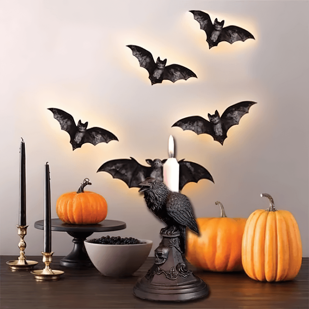 Gothic Halloween decor with bats, candles, and pumpkins, featuring a crow candle holder on a dark theme.