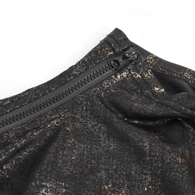 Close-up of a black gothic top featuring stylish cutouts and a zip detail, perfect for alternative fashion enthusiasts.