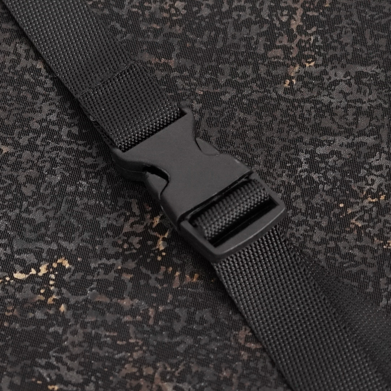 Close-up of black buckle on gothic slim fitted top, showcasing trendy alternative fashion details.