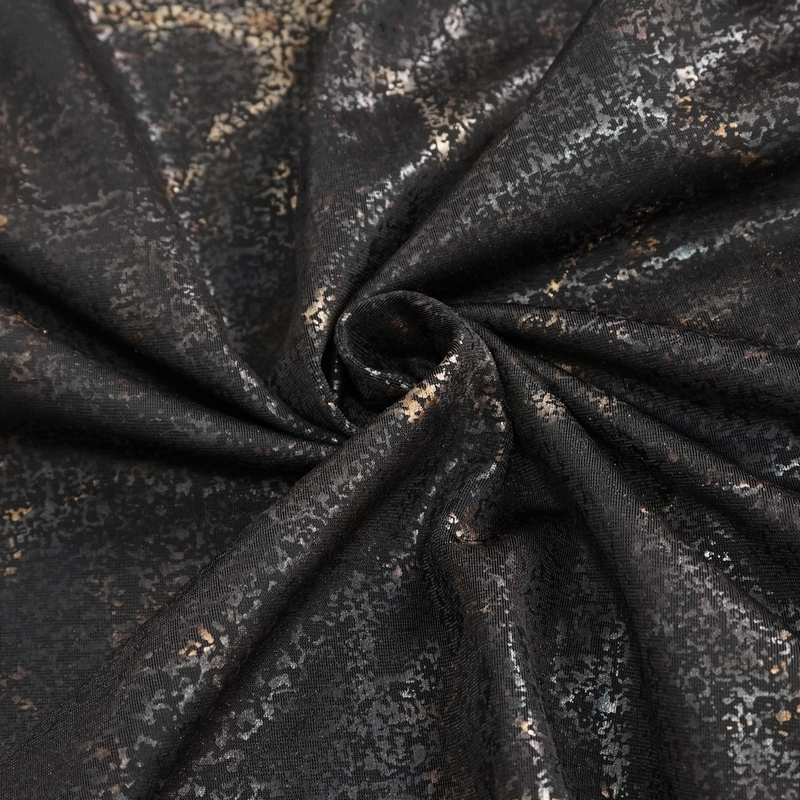 Close-up of luxurious black fabric with subtle metallic details, perfect for gothic or alternative clothing designs.