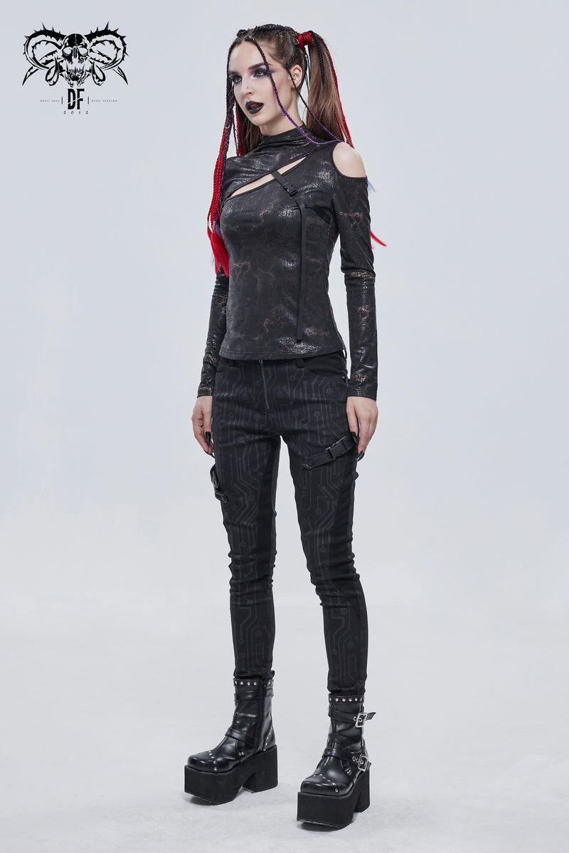 Gothic women's black cutout slim-fitted top styled with edgy pants and chunky boots, showcasing alternative fashion.