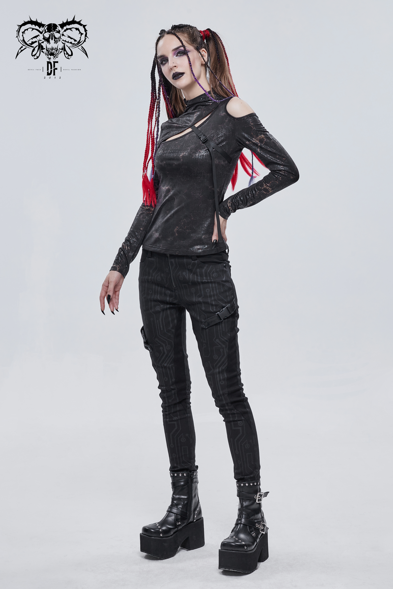 Gothic cutout slim fitted black top paired with stylish black pants and platform boots, showcasing alternative fashion.