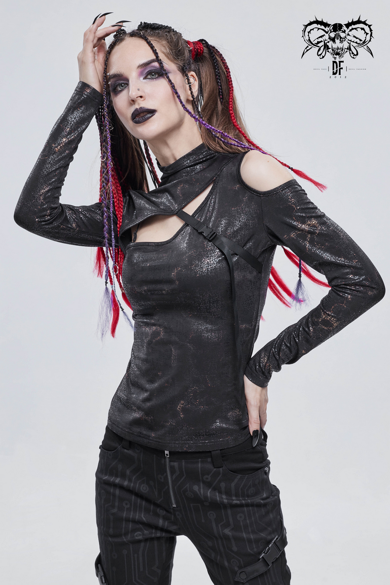 Model wearing a gothic cutout black slim-fitted top with unique detailing and edgy hairstyle, showcasing alternative fashion.
