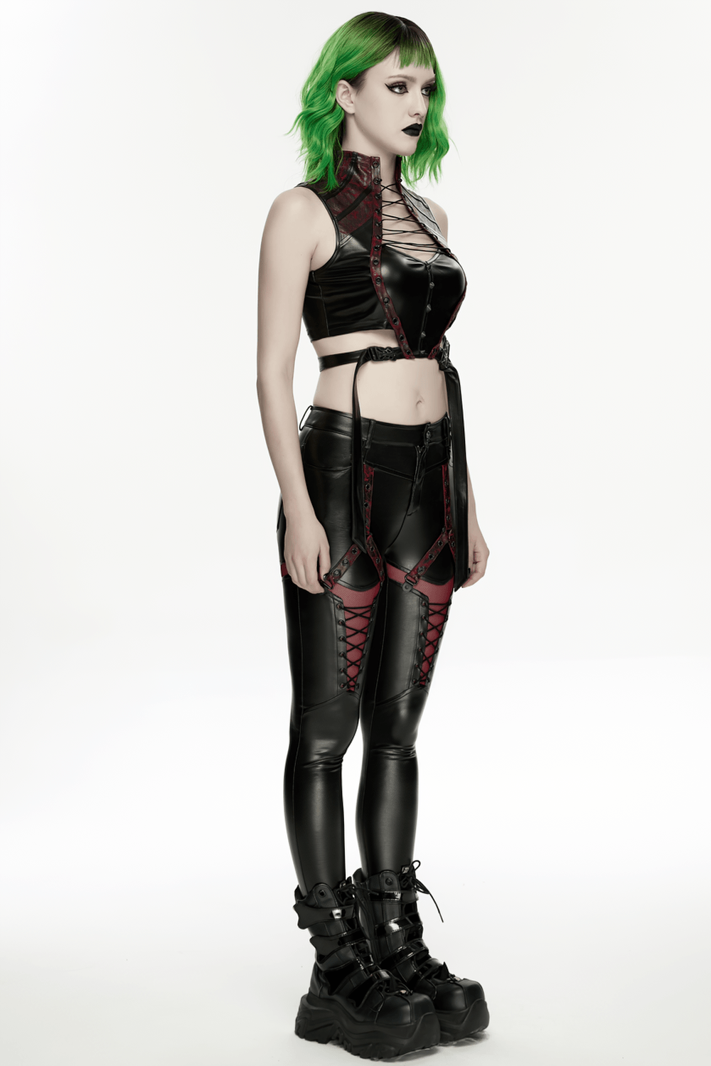Alt Tag: Gothic Cyberpunk Lace Up Faux Leather Crop Top on model, high neck lace-up front with buckle harness, edgy futuristic black crop top