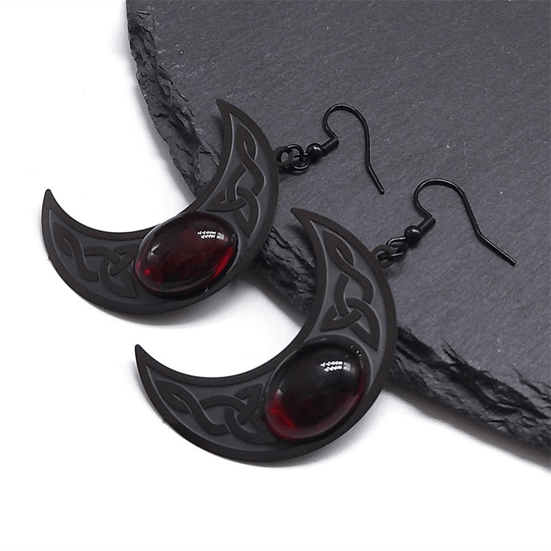 Gothic dark Celtic stainless steel earrings with red stone; crescent design for women, bold and captivating style.