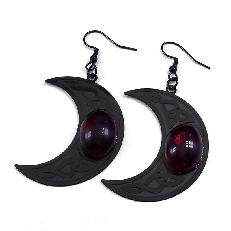 Gothic dark Celtic earrings featuring crescent shapes and striking red stones, perfect for a bold fashion statement.