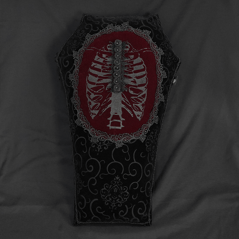 Gothic coffin-shaped pillow with ribcage design and lace trim, perfect for unique home decor.