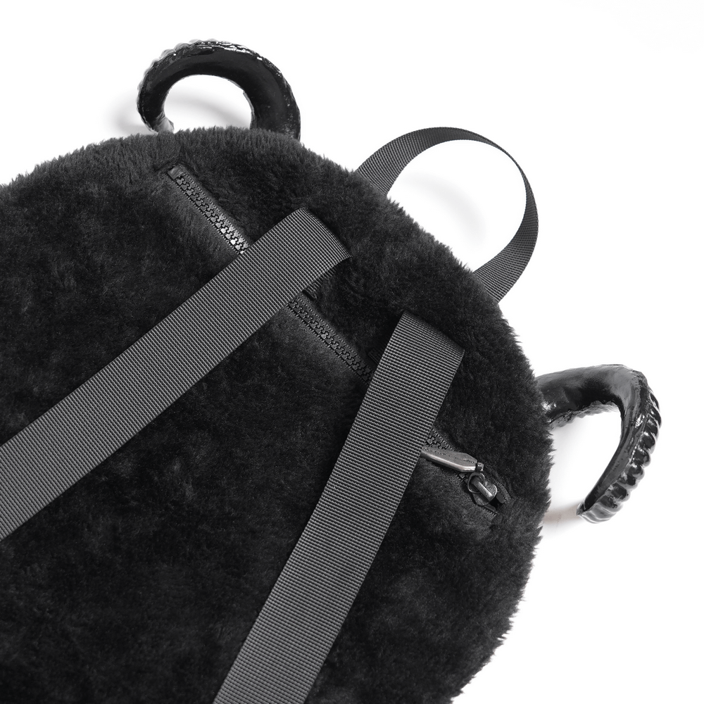 Gothic Demon Character Backpack with Horns and Spikes showing plush black fabric and adjustable straps.