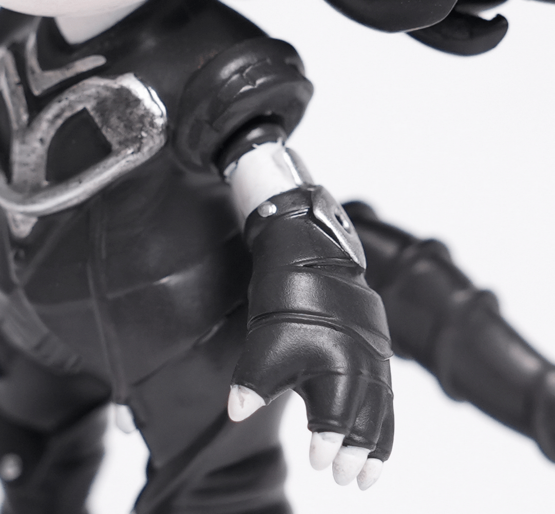 Close-up of a Gothic Demon figure showcasing its detailed black attire and skeletal hand.