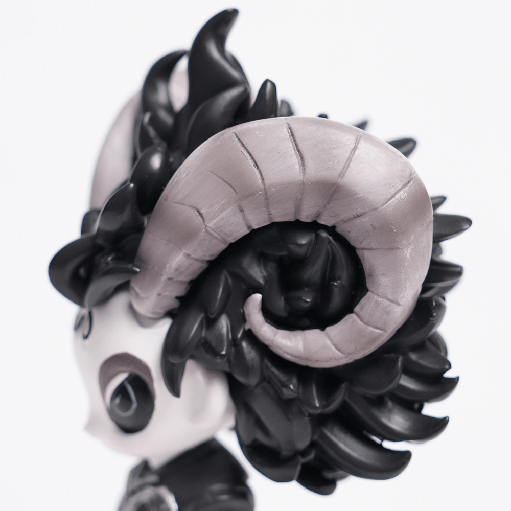 Close-up of a gothic demon figure showcasing intricate horns and stylized black fur details.