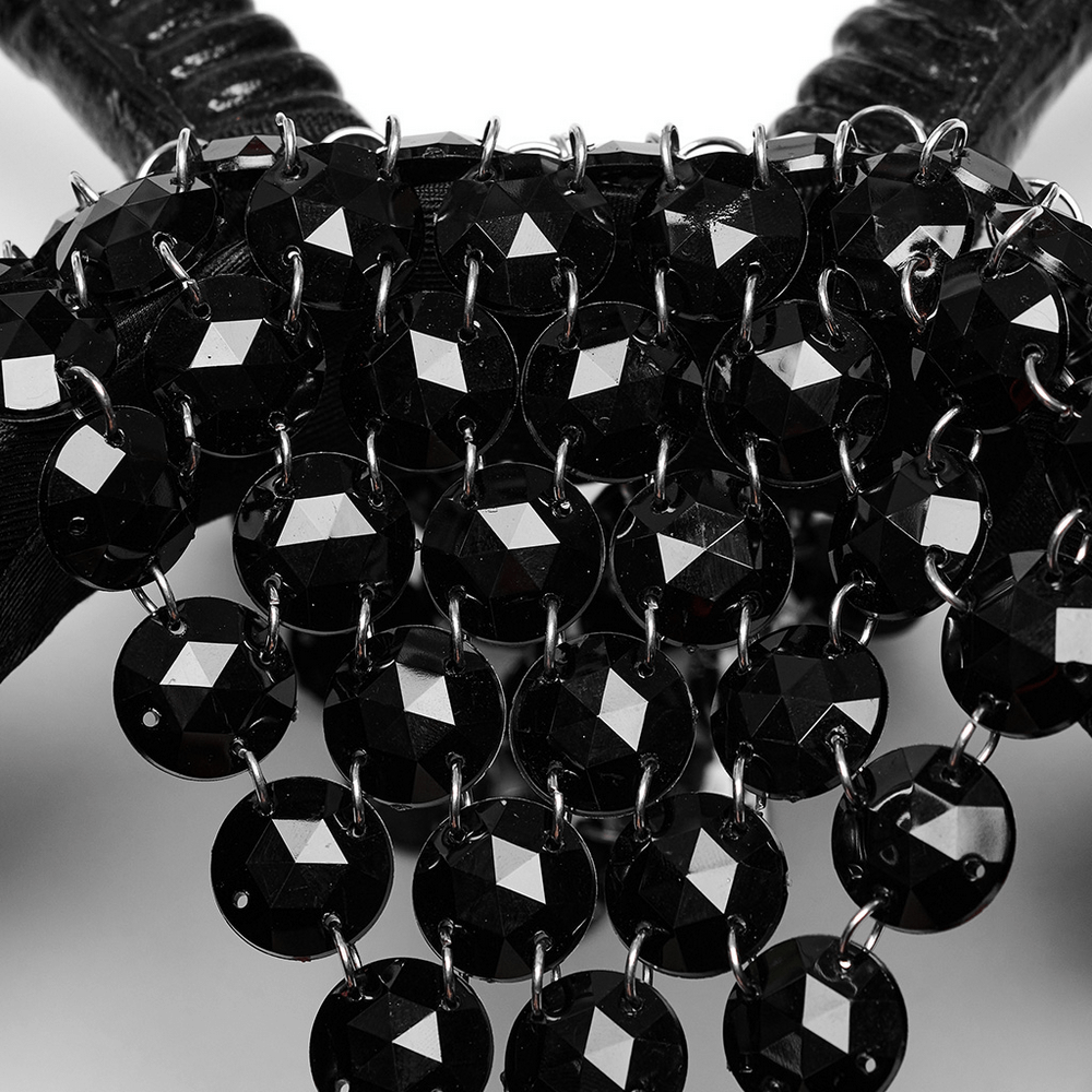 Close-up of gothic demon horn headwear featuring shimmering black acrylic embellishments and intricate detailing.