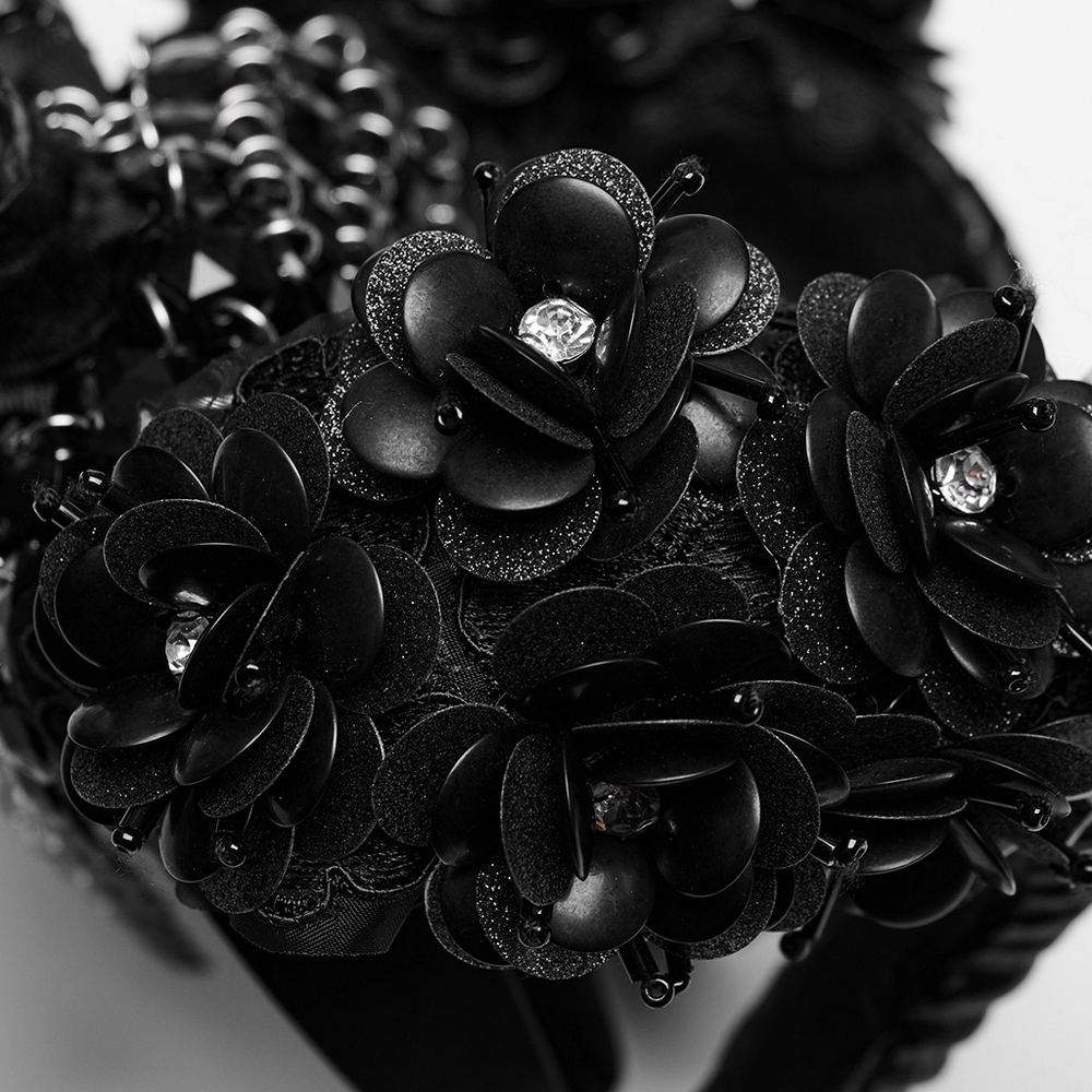 Gothic demon horn headwear adorned with glitter flowers and black floral accents for dark elegance.