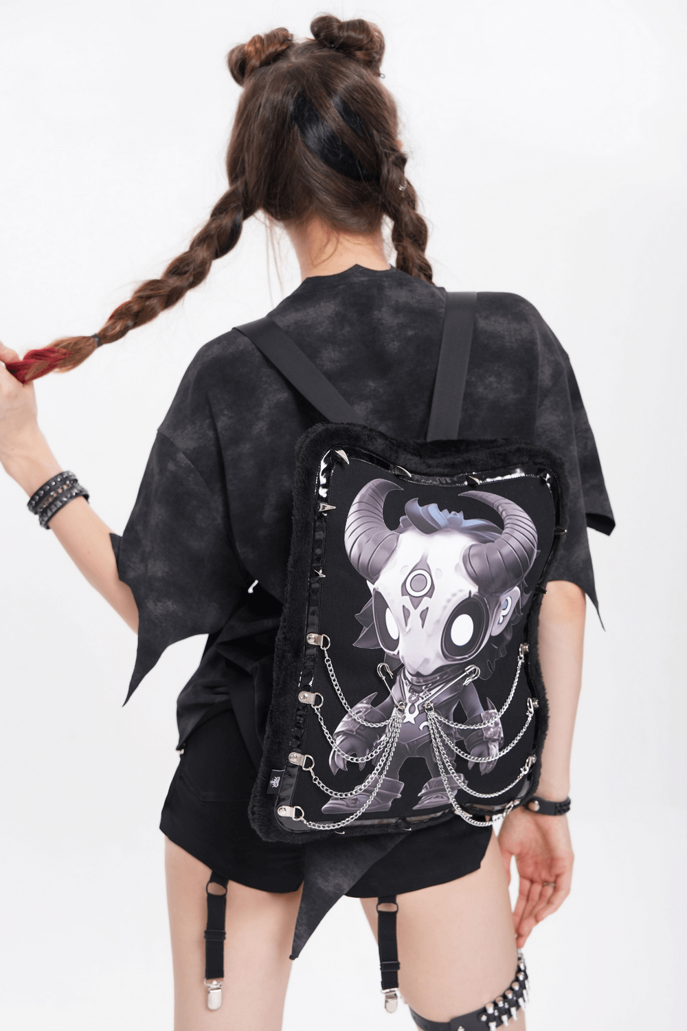 Gothic Demon Skull Backpack with Chains and Fur Trim worn by a model showing the detailed design.