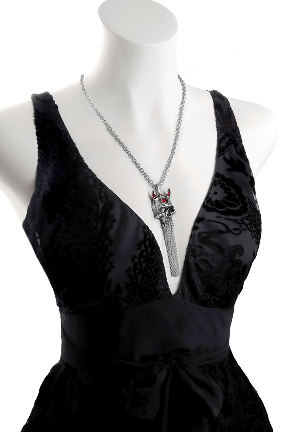 Gothic Devil Skull Pendant with Chains and Red Crystal worn on a black dress, showcasing its darkly seductive design.