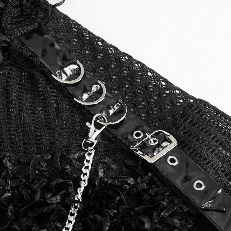 Close-up of black gothic sweater detail featuring detachable chain and glossy harness straps.